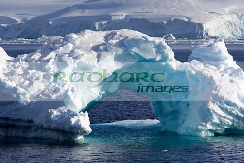arched iceberg in wilhelmina bay Antarctica