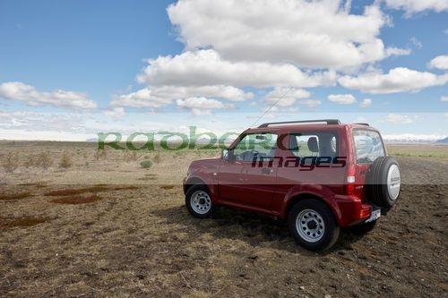 small suzuki jimny hire car jeep driven off road into fields in iceland