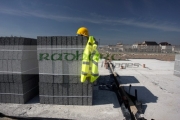 hard-hat-hivis-vest-on-pile-breeze-concrete-building-blocks-on-construction-building-site-in-northern-ireland-uk