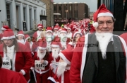 DERRY,-UNITED-KINGDOM-_-DECEMBER-09:-John-Hume.-Over-10000-people-dressed-as-santa-claus-attempt-the-Guinness-World-Record-in-Derry-Northern-Ireland-on-Derrys-Walls