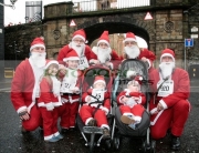 DERRY,-UNITED-KINGDOM-_-DECEMBER-09:-The-McGilloway-family-atmosphere.-Over-10000-people-dressed-as-santa-claus-attempt-the-Guinness-World-Record-in-Derry-Northern-Ireland