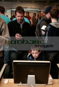 BELFAST,-UNITED-KINGDOM-_-SEPTEMBER-20:-9-year-old-Ewan-Latimer-his-dad-who-travelled-the-70-miles-from-Derry-to-be-one-the-first-in-the-queue-at-the-Apple-Store-opening-in-Victoria-Square-on-September-19,-2008-in-Belfast,-Northern-Ireland