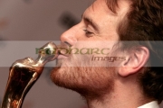 Michael-Fassbender-kisses-his-best-actor-in-feature-film-award-in-the-press-room-at-the-6th-Annual-Irish-Film-Television-Awards-at-the-Burlington-Hotel-on-February-14,-2009-in-Dublin,-Ireland