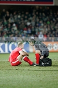 injured-welsh-player-talking-to-physio-at-an-international-friendly-football-match-between-Northern-Ireland-Wales-at-Windsor-Park-6th-February-2006