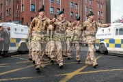 Royal-Irish-Regiment-soldiers-march-between-Police-lines-separating-republican-loyalist-protestors-at-the-Royal-Irish-Regiment-RIR-Homecoming-Parade-in-Belfast-on-September-02,-2008-in-Belfast,-Northern-Ireland.-The-parade,-which-passed-relatively-peacefully,-was-for-troops-returning-from-Iraq-Afghanistan.