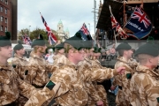 Royal-Irish-Regiment-soldiers-walk-past-loyalist-supporters-at-the-Royal-Irish-Regiment-RIR-Homecoming-Parade-in-Belfast-on-September-02,-2008-in-Belfast,-Northern-Ireland.-The-parade,-which-passed-relatively-peacefully,-was-for-troops-returning-from-Iraq-Afghanistan.
