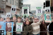 Sinn-Fein-organised-republican-protestors-hold-banners-at-the-Royal-Irish-Regiment-RIR-Homecoming-Parade-in-Belfast-on-September-02,-2008-in-Belfast,-Northern-Ireland.-The-parade,-which-passed-relatively-peacefully,-was-for-troops-returning-from-Iraq-Afghanistan.
