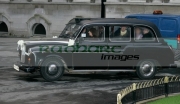 Shannon-Sickels-Grainne-Close-arrive-in-black-Belfast-Taxi-for-their-gay-wedding-under-the-UKs-new-civil-partnership-laws,-Belfast-City-Hall,-Belfast,-Northern-Ireland