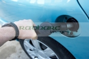 man-filling-up-car-with-diesel-fuel-pump-inserted-into-car-fuel-tank-Belfast-Northern-Ireland-UK