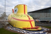 the-beatles-yellow-submarine-sculpture-outside-liverpool-john-lennon-airport-merseyside-uk.