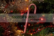 candy-cane-decoration-hanging-on-an-artificial-christmas-tree