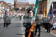 flag-bearing-colour-party-march-along-the-falls-road-on-Easter-Sunday-during-Easter-Rising-Commemoration-Falls-Road-Belfast-Northern-Ireland-UK