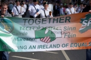 Sinn-Fein-ireland-equals-together-banner-being-carried-on-Easter-Sunday-during-Easter-Rising-Commemoration-Falls-Road-Belfast-Northern-Ireland-UK