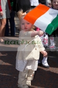 young-toddler-girl-waving-an-irish-tricolour-flag-on-Easter-Sunday-during-Easter-Rising-Commemoration-Falls-Road-Belfast-Northern-Ireland-UK