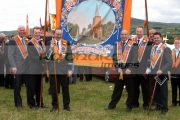 members-loyal-orange-order-orangemen-with-banner-in-field-during-12th-July-Orangefest-celebrations-in-Dromara-county-down-northern-ireland