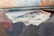 hiding-british-pounds-cash-in-an-envelope-under-the-mattress