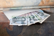 hiding-chinese-renminbi-cash-in-an-envelope-under-the-mattress