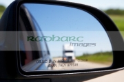 objects-in-mirror-closer-than-they-appear-with-following-semi-truck-on-canadian-highway