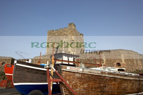 old-fishing-boats-in-front-carrickfergus-castle-in-northern-ireland