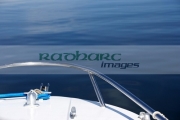 prow-grabrail-small-speedboat-out-on-the-flat-calm-water