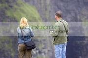 male-blonde-haired-female-tourists-taking-photos-at-the-Cliffs-Moher,-County-Clare,-Republic-Ireland