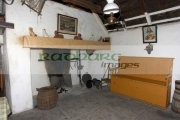 interior-old-irish-simple-peasant-worker-cottage-including-picture-sacred-heart-on-the-wall-Bunratty-Folk-Park,-County-Clare,-Republic-Ireland