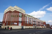 former-wilkinsons-shirt-factory-on-the-strand-road-Derry-city-county-londonderry-northern-ireland-uk.-It-is-now-supermarket,-commercial-residential-building