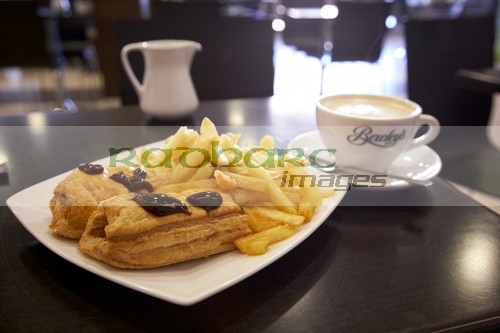 two-sausage-rolls-chips-with-brown-sauce-cup-coffee-in-cheap-cafe-in-the-republic-ireland