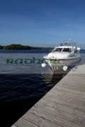 cabin-cruiser-moored-at-jetty-on-lower-lough-erne-county-fermanagh-northern-ireland-uk