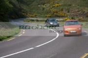 cars-on-narrow-twisy-bend-section-the-main-tourist-route-road-winding-through-fields-the-dingle-peninsula-en-route-to-dingle-county-kerry-republic-ireland