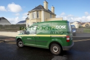 green-an-post-irish-postal-service-delivery-van-in-small-rural-town-enniscrone-county-sligo-republic-ireland