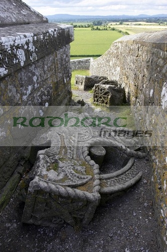 remains-high-stone-celtic-cross-the-OScally-monument-broken-lying-on-the-ground-in-the-Rock-Cashel,-Cashel,-County-Tipperary,-Republic-Ireland