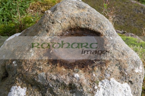 ancient-irish-bullaun-stone-or-font-the-ruins-St-Kierans-errigal-keerogue-church-county-tyrone-