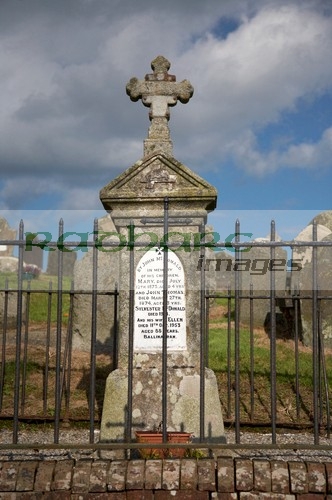 headstones-cross-on-traditional-family-burial-plot-in-the-graveyard-at-St-John-the-Apostle-Ardnamine-church-courtown-