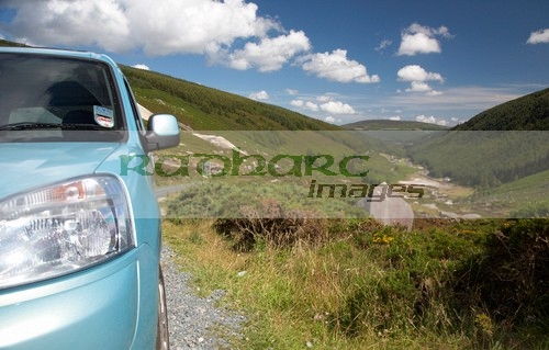 headlight-front-blue-car-parked-in-road-layby-in-the-wicklow-gap-looking-back-towards-glendalough