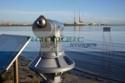 tourist-telescope-on-strand-beach-at-sandymount-on-Dublin-bay-republic-ireland-with-poolbeg-power-station-in-the-background