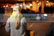 female-shopper-waiting-at-pedestrian-crossing-on-oconnell-street-dublin-republic-ireland