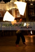 blonde-female-fire-dancer-street-entertainer-dances-with-fire-in-front-the-cloth-hall-in-krakow