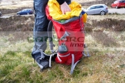hiker-hillwalker-packing-rucksack-before-going-hiking-in-the-highlands-Scotland-UK