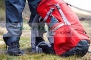 hiker-hillwalker-wearing-boots-waterproofs-rucksack-in-the-highlands-Scotland-UK