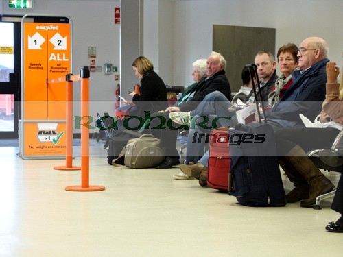 flying - passengers at departure gate