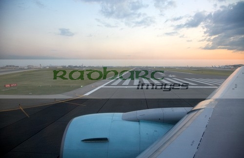 flight taxiing to runway at dusk