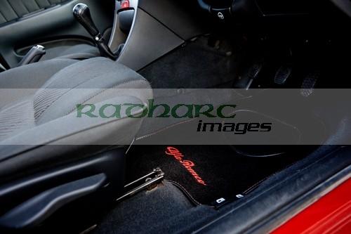 tailored car mats in the interior of an Alfa Romeo 156