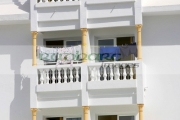 clothes-drying-in-hot-summer-sun-on-balconies-tourist-hotel-rooms-in-hotel-in-hammamet-tunisia