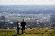 tourist-couple-on-mcarts-fort-at-the-top-Cave-Hill-overlooking-belfast-on-sunny-sunday-morning,-Belfast,-Northern-Ireland